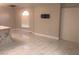 Spacious living room featuring tile flooring and a TV mount at 2970 Juniper Hills Blvd # 102, Las Vegas, NV 89142