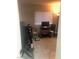 Functional home office space with a large window, desk setup, and storage shelves for organization at 2970 Juniper Hills Blvd # 102, Las Vegas, NV 89142