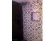 Close up of an elegant shower featuring unique black and white patterned tile at 2970 Juniper Hills Blvd # 102, Las Vegas, NV 89142
