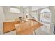 Basement bar area complete with sink, cabinets, and views to the outdoor pool area at 3367 Trickling Stream Cir, Las Vegas, NV 89117