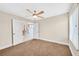 Inviting bedroom with plush carpet, neutral paint, and a ceiling fan for added comfort and style at 3367 Trickling Stream Cir, Las Vegas, NV 89117