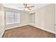 Cozy bedroom offering natural light, ceiling fan, neutral walls, and a built-in bookshelf at 3367 Trickling Stream Cir, Las Vegas, NV 89117