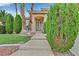 Inviting front entrance with manicured landscaping and an elegant wrought iron security door at 3367 Trickling Stream Cir, Las Vegas, NV 89117