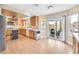 Charming kitchen featuring a gas range, center island, and sliding doors to the outdoor dining space at 3367 Trickling Stream Cir, Las Vegas, NV 89117