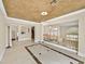 Spacious room showcasing chandelier, tile floors, and staircase views at 3367 Trickling Stream Cir, Las Vegas, NV 89117