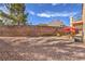 Large backyard featuring desert landscaping and block wall at 3401 Bedfordshire Pl, Las Vegas, NV 89129
