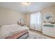Bedroom featuring desk, white dresser, neutral walls, and light floors at 3401 Bedfordshire Pl, Las Vegas, NV 89129