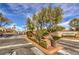 Cambridge Crossing community entrance with gated access and mature landscaping at 3401 Bedfordshire Pl, Las Vegas, NV 89129