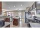 Kitchen and dining area includes stainless steel appliances and an island at 3401 Bedfordshire Pl, Las Vegas, NV 89129