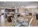 The view shows the open concept layout of the kitchen, dining and living areas at 3401 Bedfordshire Pl, Las Vegas, NV 89129