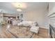 Bright living room features a crystal chandelier, fireplace and access to the kitchen and dining area at 3401 Bedfordshire Pl, Las Vegas, NV 89129