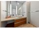 Modern bathroom vanity featuring a vessel sink, wood-style cabinets, and a large mirror at 3726 Las Vegas Blvd # 303, Las Vegas, NV 89158