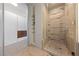 Modern bathroom featuring glass enclosed shower with tile surround, and a linen closet at 3726 Las Vegas Blvd # 303, Las Vegas, NV 89158