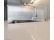 Close up of a modern quartz kitchen countertop with a stainless steel sink and faucet at 3726 Las Vegas Blvd # 303, Las Vegas, NV 89158