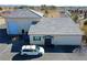 Winery's building featuring tile roofs, exterior walls, parking area, and a minivan at 3780 E Kellogg Rd, Pahrump, NV 89061