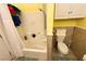 Clean, bright bathroom with a bathtub, shower, and modern toilet with lots of TP at 3780 E Kellogg Rd, Pahrump, NV 89061