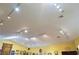 A well-lit ceiling with modern track lighting and fixtures enhances the bright, open feel of the commercial interior at 3780 E Kellogg Rd, Pahrump, NV 89061