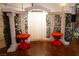 Elegant ceremony space with decorative pillars, draped fabric, and side tables at 3780 E Kellogg Rd, Pahrump, NV 89061