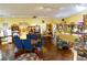 Spacious dining area with hardwood floors, bright lighting and colorful tables perfect for gatherings and Gathering dinners at 3780 E Kellogg Rd, Pahrump, NV 89061