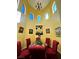 Charming dining area featuring high ceilings, arched windows, and colorful decor at 3780 E Kellogg Rd, Pahrump, NV 89061