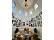 Unique dining area featuring high ceilings, arched windows, and walls adorned with vintage movie posters and mirrors, creating a themed space at 3780 E Kellogg Rd, Pahrump, NV 89061