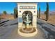 Inviting entrance with the Sanders Winery sign, framed by lush greenery, arched design, and fountain at 3780 E Kellogg Rd, Pahrump, NV 89061