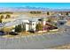 Spacious parking area, outdoor patio, and winery buildings with green trim and mountain views at 3780 E Kellogg Rd, Pahrump, NV 89061