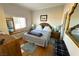 Comfortable main bedroom with a window and nice furnishings, including a large bed at 3780 E Kellogg Rd, Pahrump, NV 89061