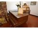 Close-up view of a vintage piano with decorative items and framed pictures at 3780 E Kellogg Rd, Pahrump, NV 89061