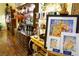 Showroom showcasing artwork, wooden shelves, and wine-themed decor, with many items available for purchase at 3780 E Kellogg Rd, Pahrump, NV 89061