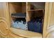 Built-in storage shelves with cardboard boxes containing paper rolls, located inside the house, for storing essential items at 3780 E Kellogg Rd, Pahrump, NV 89061