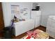 Practical storage area with refrigerator, freezer, and essential organizational tools at 3780 E Kellogg Rd, Pahrump, NV 89061