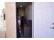 Small storage area, seen from doorway, holds various items with a door and hardware included at 3780 E Kellogg Rd, Pahrump, NV 89061