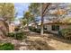 The Backyard features low-maintenance landscaping with mature trees, shrubs, and gravel ground cover at 425 Golden State St, Henderson, NV 89012