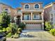 Inviting two-story home with lush landscaping, a spacious driveway, and a two-car garage at 4488 Mission Meadow Cir, Las Vegas, NV 89139