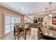 Open concept kitchen with seating for six, and a view into the living area with fireplace at 454 White Heart Rd, Las Vegas, NV 89148