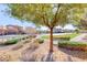 Scenic view of the neighborhood featuring lush greenery, mature trees, and a well-maintained walking path at 454 White Heart Rd, Las Vegas, NV 89148