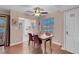 Dining area featuring hardwood floors, a ceiling fan, a view to the outside, and adjacent kitchen at 4861 S Torrey Pines Dr # 201, Las Vegas, NV 89103