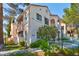 Exterior view of a two-story building with balconies and well-kept landscaping at 4861 S Torrey Pines Dr # 201, Las Vegas, NV 89103