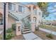 Apartment exterior featuring stairs leading to the second floor with landscaped surroundings and covered parking spots at 4861 S Torrey Pines Dr # 201, Las Vegas, NV 89103