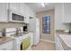 Cozy kitchen with white appliances and plenty of cabinet space at 4861 S Torrey Pines Dr # 201, Las Vegas, NV 89103