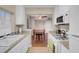 Bright kitchen with granite countertops that opens to dining room at 4861 S Torrey Pines Dr # 201, Las Vegas, NV 89103