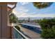 View from balcony overlooking carport parking and lush community landscaping at 4861 S Torrey Pines Dr # 201, Las Vegas, NV 89103