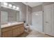Bright bathroom featuring granite countertops, light wood cabinets, and shower over tub at 5250 S Rainbow Blvd # 2165, Las Vegas, NV 89118