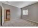 Bedroom with neutral walls and carpet and entry to the laundry closet at 5250 S Rainbow Blvd # 2165, Las Vegas, NV 89118
