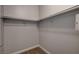 This walk-in closet features a shelf and carpeted floor at 5250 S Rainbow Blvd # 2165, Las Vegas, NV 89118