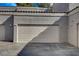 Spacious two-car garage with modern door and ample driveway space for parking and easy access at 5250 S Rainbow Blvd # 2165, Las Vegas, NV 89118