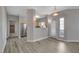 Open living room features modern floors and view to the kitchen at 5250 S Rainbow Blvd # 2165, Las Vegas, NV 89118