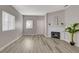 Bright living room features a fireplace, modern flooring and neutral paint at 5250 S Rainbow Blvd # 2165, Las Vegas, NV 89118