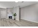 Open living room features a fireplace and view to a second room at 5250 S Rainbow Blvd # 2165, Las Vegas, NV 89118